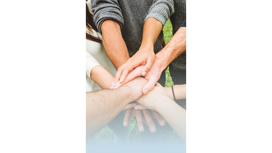 Group of people with hands in circle