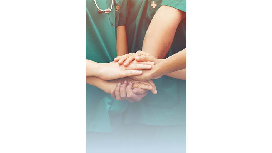 Nurses stack hands in a positive work environment