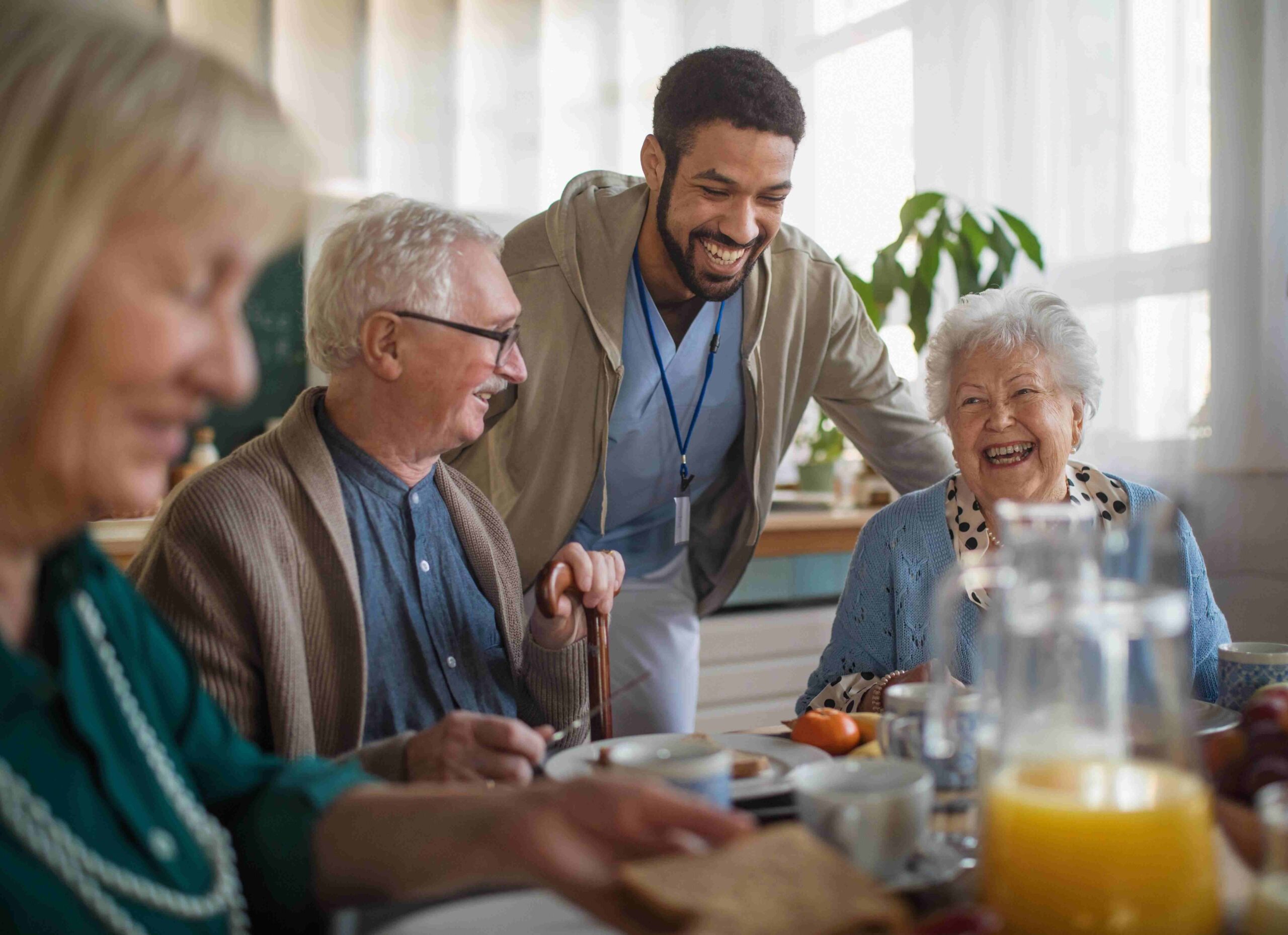 Residents enjoying a meal at an assisted living facility